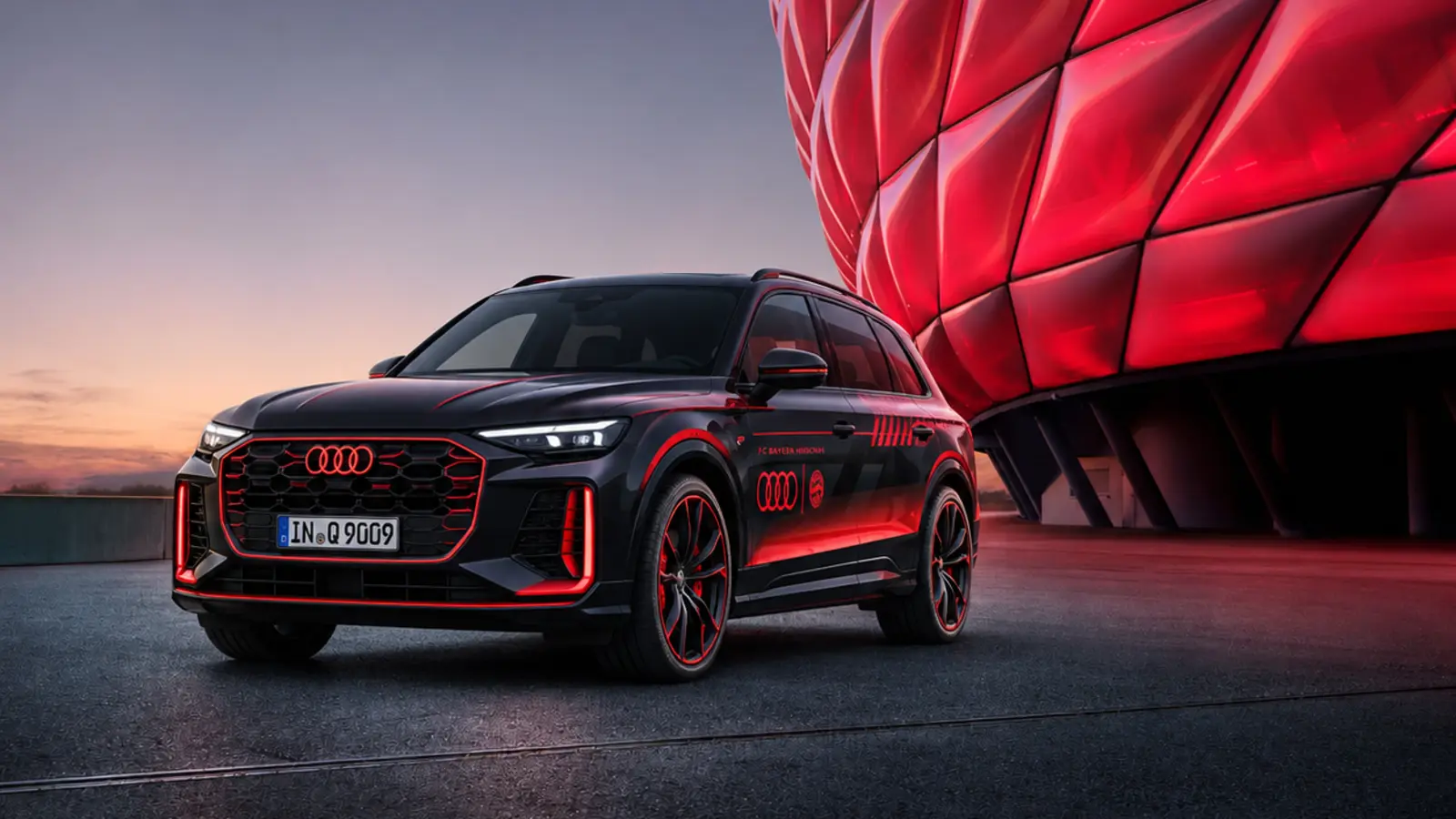 AI-rendered dark Audi Q9 outside a red-lit stadium, illustrating Audi’s relationship with Bayern and Volkswagen’s football strategy.
